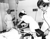 Nurses with defibrillator, c1965